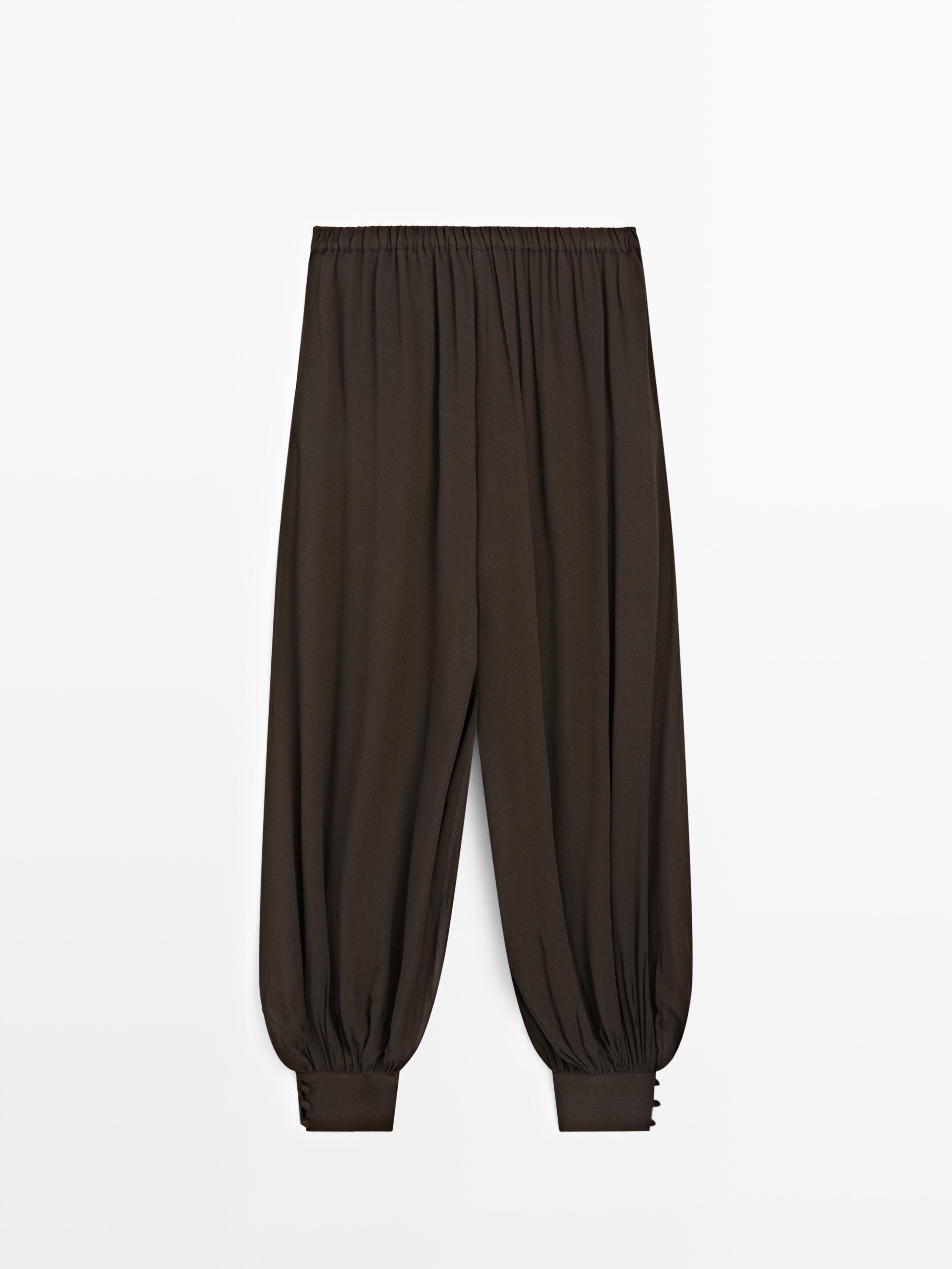 Pantalon bouffant semi-transparent avec boutons